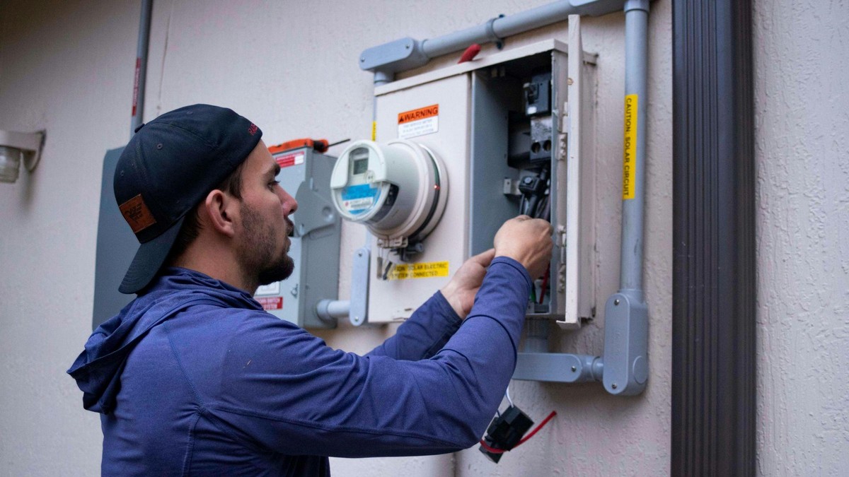 Technician performing AC maintenance in Central Valley.