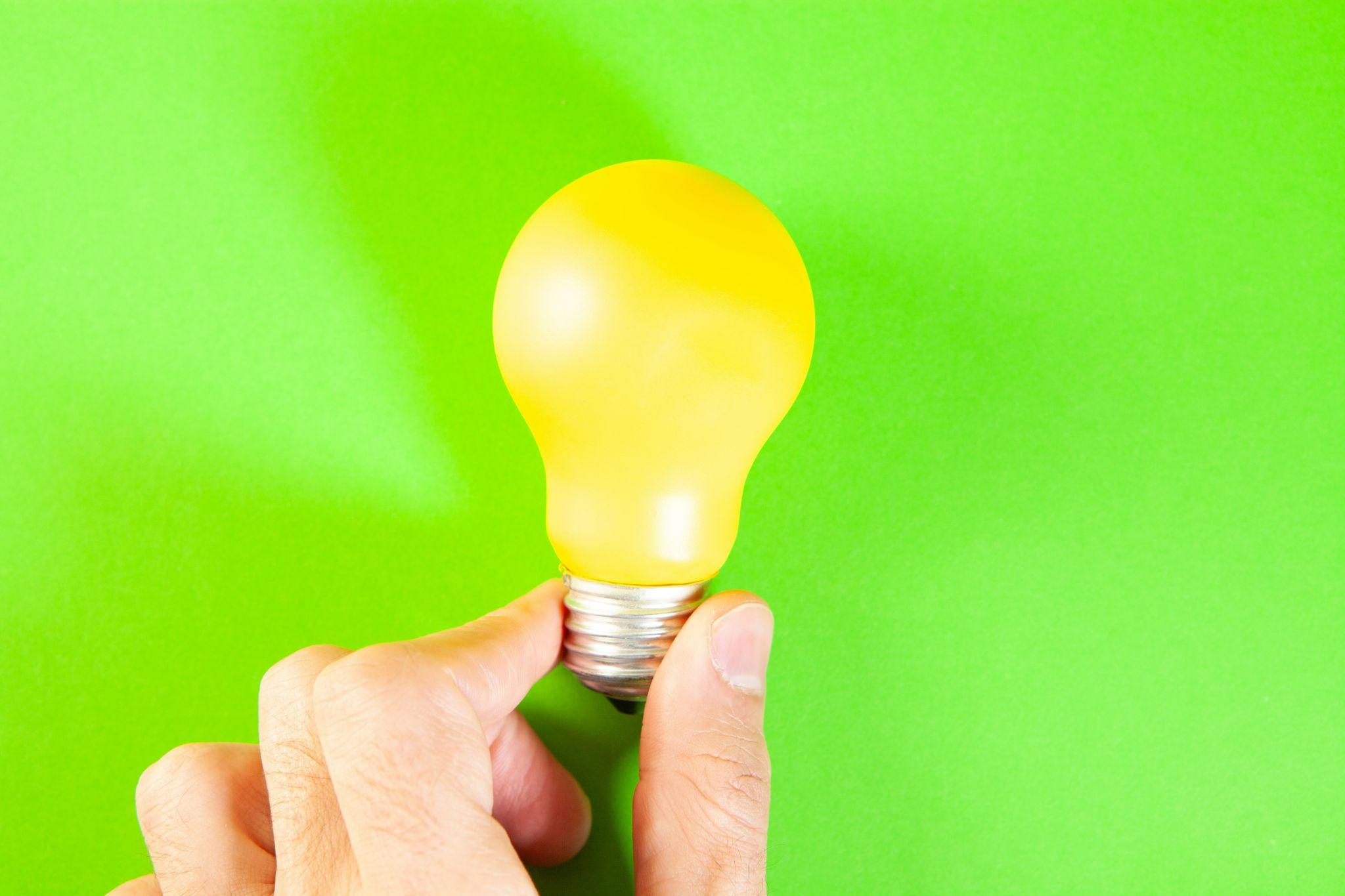 A light bulb represents energy-saving solutions offered through energy services in Fresno.