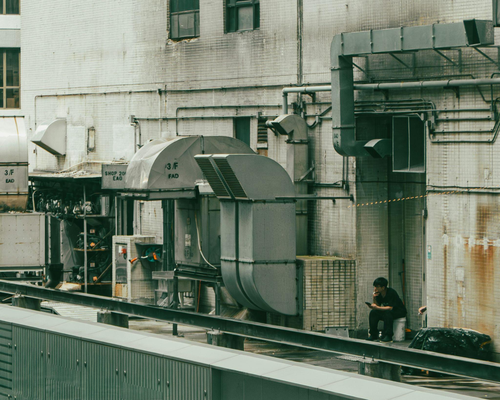 Large rooftop ventilation ducts and industrial equipment illustrate the need for commercial HVAC services in Fresno.